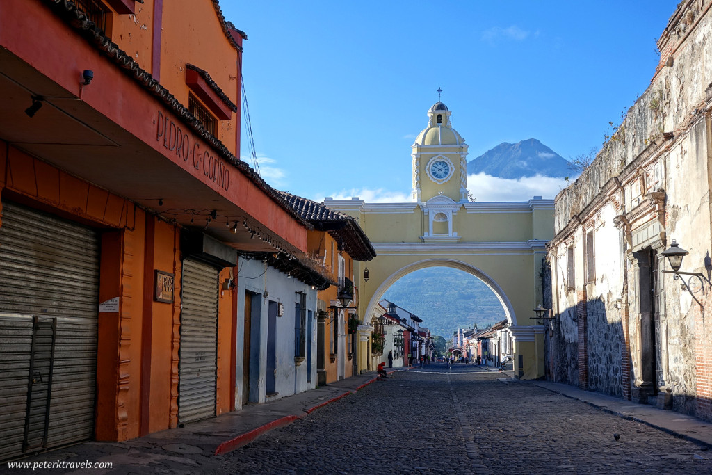 Early morning street view with Arco Santa Catalina and Volcan Agua, Antigua Guatemala