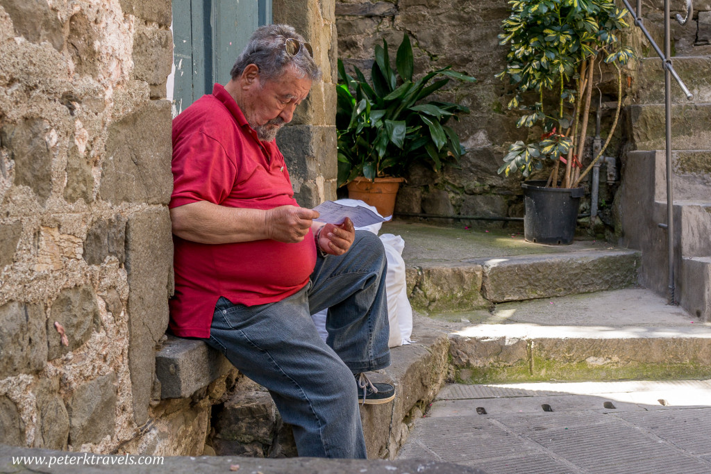 Man relaxing in Corniglia, Italy.